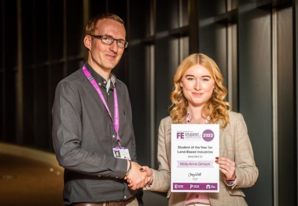Molly Anne Gimson receiving her Further Education award certificate from Chris Sturdy Head of Animal and Equine Easton College CREDIT DAVID KIRKHAM 1