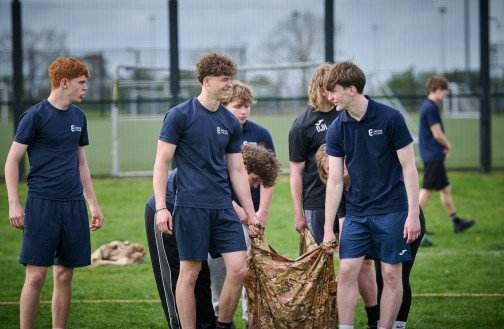 Uniformed Services students engaged in a team-building activity
