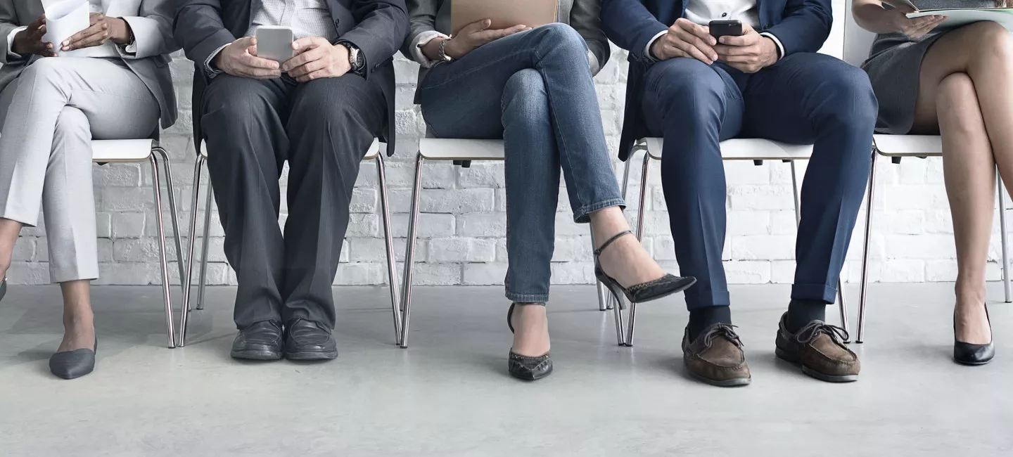 Job candidates seated before an interview