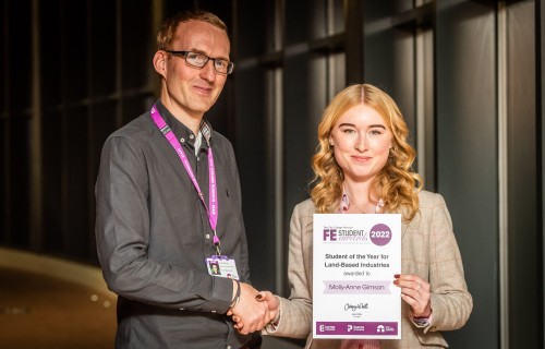 Molly Anne Gimson receiving her Further Education award certificate from Chris Sturdy Head of Animal and Equine Easton College CREDIT DAVID KIRKHAM 1